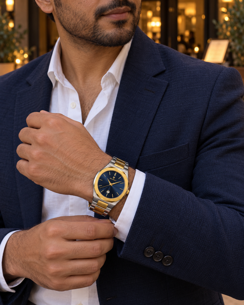 HOURSLY blue sunburst dial with gold logo, gold bezel and silver-and-gold bracelet — evening