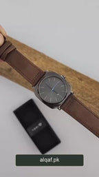 TOMI T-084 watch showcase with alqaf.pk branding